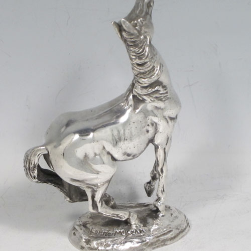 Sterling silver cast model of a horse in original velvet-lined presentation box. A very fine model by the contemporary sculptress Lorne McKean (view her website at www.lornemckean.com). Hallmarked for London in 1975. The dimensions of this hand-made silver horse are height 11 cms (4.5 inches), length 8 cms (3 inches), and it weighs approx. 612g (19.7 troy ounces).