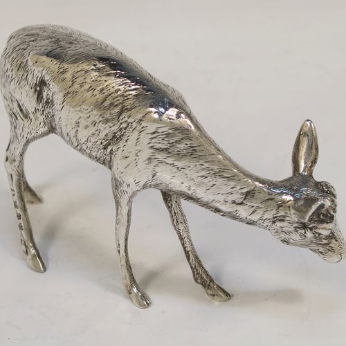 A very handsome Antique Edwardian Sterling Silver pair of solid cast deer, showing a male stag and female doe in realistic traditional poses, all finely detailed with hand-chased bodies. This  beautiful pair of silver deer were originally made on the Continent and imported with full hallmarks for London in 1902. The dimensions of these fine hand-made sterling silver deer are height of male stag  7.5 cms (3 inches), length of female doe 12 cms (4.75 inches), and they weigh a total approx. 275g (8.9 troy ounces).   