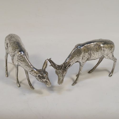 A very handsome Antique Edwardian Sterling Silver pair of solid cast deer, showing a male stag and female doe in realistic traditional poses, all finely detailed with hand-chased bodies. This  beautiful pair of silver deer were originally made on the Continent and imported with full hallmarks for London in 1902. The dimensions of these fine hand-made sterling silver deer are height of male stag  7.5 cms (3 inches), length of female doe 12 cms (4.75 inches), and they weigh a total approx. 275g (8.9 troy ounces).   