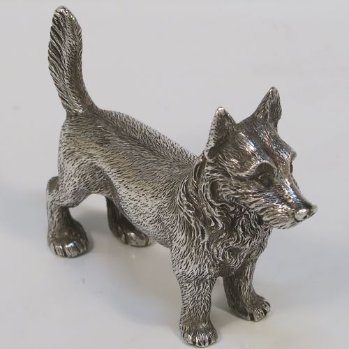 A handsome Antique Sterling Silver cast model of a Terrier dog, having a realistically hand-chased body. This beautiful antique silver dog model was made by Andrew Barrett of London in 1911. The dimensions of this fine hand-made antique silver dog  are height 6 cms (2.25 inches), length 7.5 cms (3 inches), and it weighs approx. 92g (3 troy ounces).  