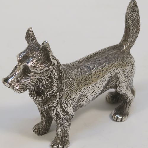 A handsome Antique Sterling Silver cast model of a Terrier dog, having a realistically hand-chased body. This beautiful antique silver dog model was made by Andrew Barrett of London in 1911. The dimensions of this fine hand-made antique silver dog  are height 6 cms (2.25 inches), length 7.5 cms (3 inches), and it weighs approx. 92g (3 troy ounces).  