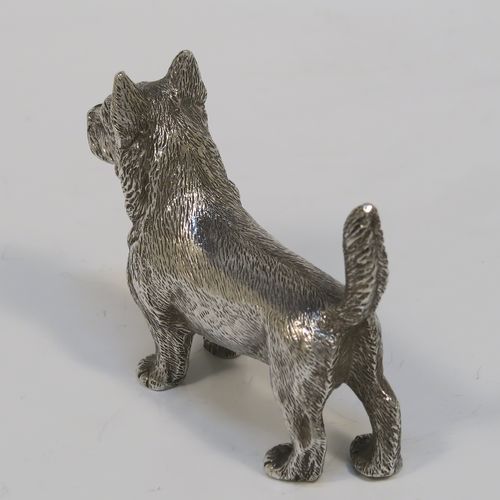 A handsome Antique Sterling Silver cast model of a Terrier dog, having a realistically hand-chased body. This beautiful antique silver dog model was made by Andrew Barrett of London in 1911. The dimensions of this fine hand-made antique silver dog  are height 6 cms (2.25 inches), length 7.5 cms (3 inches), and it weighs approx. 92g (3 troy ounces).  