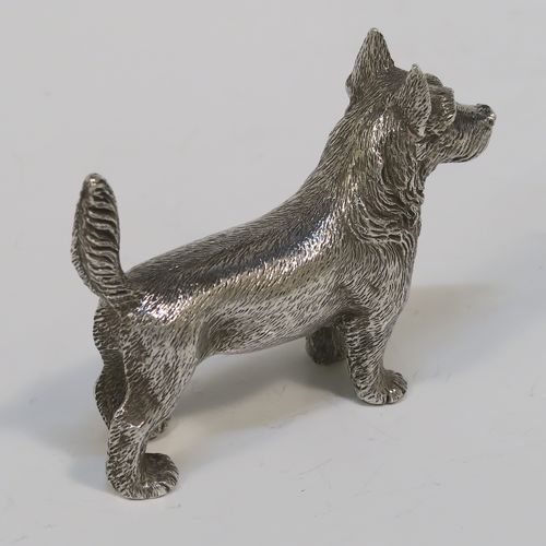 A handsome Antique Sterling Silver cast model of a Terrier dog, having a realistically hand-chased body. This beautiful antique silver dog model was made by Andrew Barrett of London in 1911. The dimensions of this fine hand-made antique silver dog  are height 6 cms (2.25 inches), length 7.5 cms (3 inches), and it weighs approx. 92g (3 troy ounces).  