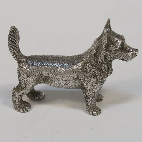 A handsome Antique Sterling Silver cast model of a Terrier dog, having a realistically hand-chased body. This beautiful antique silver dog model was made by Andrew Barrett of London in 1911. The dimensions of this fine hand-made antique silver dog  are height 6 cms (2.25 inches), length 7.5 cms (3 inches), and it weighs approx. 92g (3 troy ounces).  