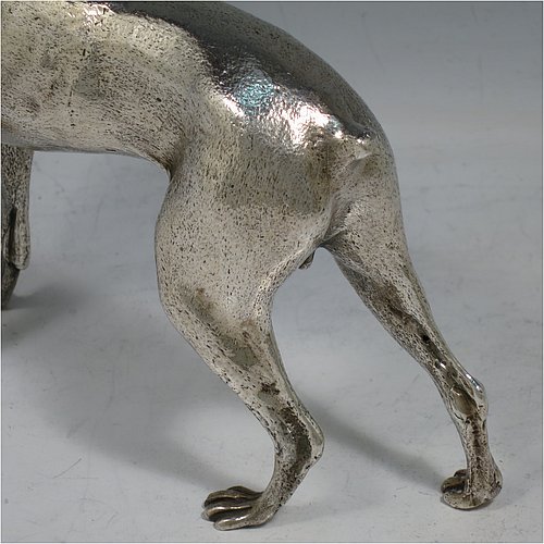 A large cast 800 Standard Silver model of a Doberman Pinscher dog, having a realistically hand-chased body. Made in Europe in ca. 1930. The dimensions of this fine hand-made 800 standard silver Doberman Pinscher dog model are height 17 cms (6.75 inches), length 19 cms (7.5 inches), width 5 cms (2.5 inches), and it weighs approx. 430g (13.9 troy ounces).    