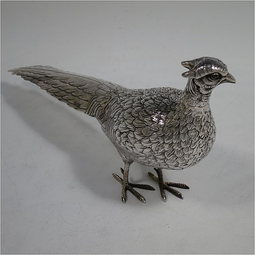 A very handsome pair of Dutch Continental 833 standard Silver pheasants, showing a male and female bird in realistic traditional poses, finely detailed with hand-chased bodies and tail feathers, and with removable heads. Made in Holland in 1948. The dimensions of these fine hand-made silver pheasants are length of male bird 26 cms (10.25 inches), height 12.5 cms (5 inches), and they weigh a total approx. 413g (13.3 troy ounces).    