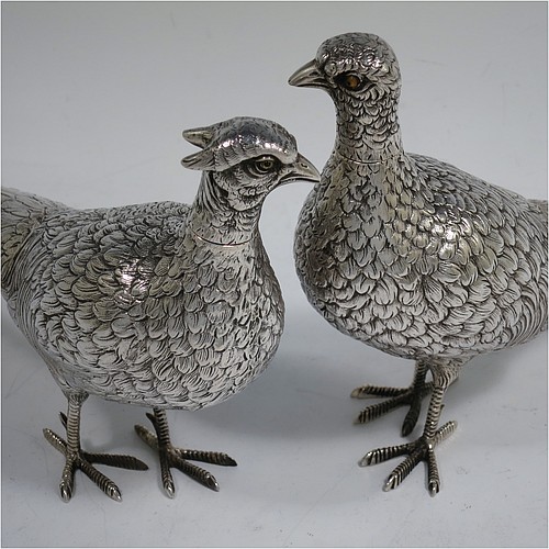 A very handsome pair of Dutch Continental 833 standard Silver pheasants, showing a male and female bird in realistic traditional poses, finely detailed with hand-chased bodies and tail feathers, and with removable heads. Made in Holland in 1948. The dimensions of these fine hand-made silver pheasants are length of male bird 26 cms (10.25 inches), height 12.5 cms (5 inches), and they weigh a total approx. 413g (13.3 troy ounces).    