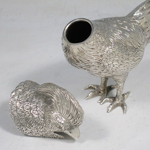 An Antique Edwardian Sterling Silver model of a King Pheasant bird, having realistically hand-chased feathers, a pull-off head, and cast feet. Made in ca. 1900 and imported from Continental Europe. The dimensions of this fine hand-made antique silver King Pheasant bird model are height 11.5 cms (4.5 inches), length 21 cms (8 inches), width 5 cms (2 inches), and it weighs approx. 175g (5.6 troy ounces).    