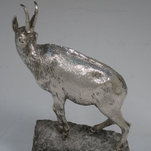 A very handsome Sterling Silver cast model of a goat, realistic handmade large Goat mounted on a piece of grey granite. Made by Holland and Holland of London in ca. 1970. The dimensions of this hand-made silver mountain goat Ibex are height (inc. granite mount) 20 cms (8 inches), and length 13 cms (5 inches).   