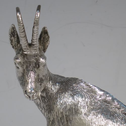 A very handsome Sterling Silver cast model of a goat, realistic handmade large Goat mounted on a piece of grey granite. Made by Holland and Holland of London in ca. 1970. The dimensions of this hand-made silver mountain goat Ibex are height (inc. granite mount) 20 cms (8 inches), and length 13 cms (5 inches).   