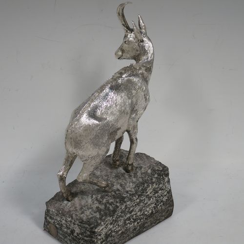 A very handsome Sterling Silver cast model of a goat, realistic handmade large Goat mounted on a piece of grey granite. Made by Holland and Holland of London in ca. 1970. The dimensions of this hand-made silver mountain goat Ibex are height (inc. granite mount) 20 cms (8 inches), and length 13 cms (5 inches).   