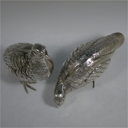 A very handsome and large pair of Antique Edwardian Silver-Plated partridge bird models, having realistically hand-chased feathers, faces, and feet. Made in ca. 1910 in England. The dimensions of this fine hand-made antique silver plated pair of partridge model birds are height 16.5 cms (6.5 inches), length 19 cms (7.5 inches), and width 7.5 cms (3 inches).    