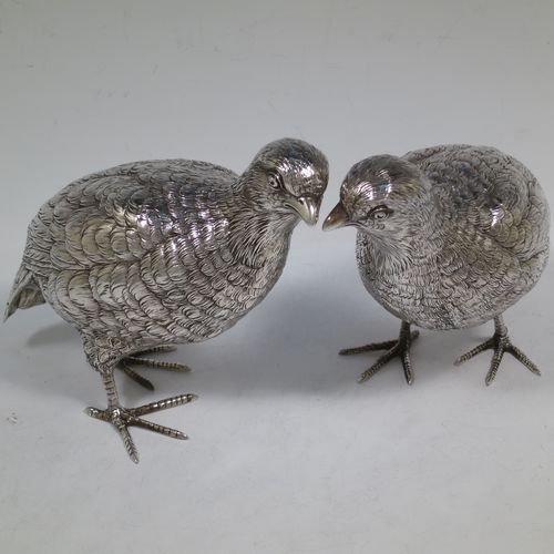 A very handsome and large pair of Sterling Silver partridge bird models, having realistically hand-chased feathers, faces, and feet. Bearing Import marks for London 1934. The dimensions of this fine hand-made sterling silver pair of partridge model birds are height 14 cms (5.5 inches), length 20 cms (8 inches), width 8 cms (3 inches), and they weigh a total of approx. 753g (24 troy ounces).    