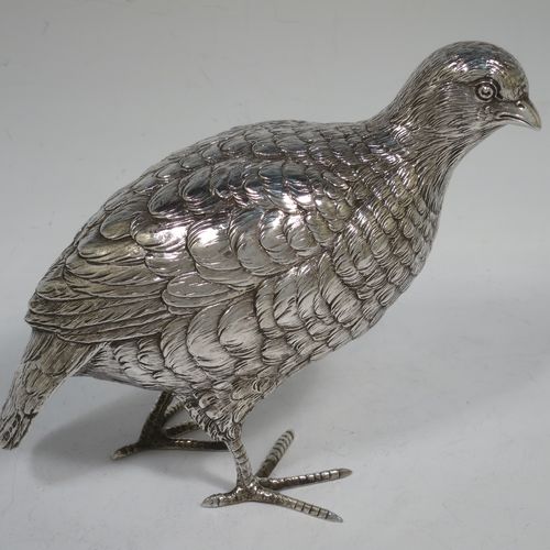 A very handsome and large pair of Sterling Silver partridge bird models, having realistically hand-chased feathers, faces, and feet. Bearing Import marks for London 1934. The dimensions of this fine hand-made sterling silver pair of partridge model birds are height 14 cms (5.5 inches), length 20 cms (8 inches), width 8 cms (3 inches), and they weigh a total of approx. 753g (24 troy ounces).    