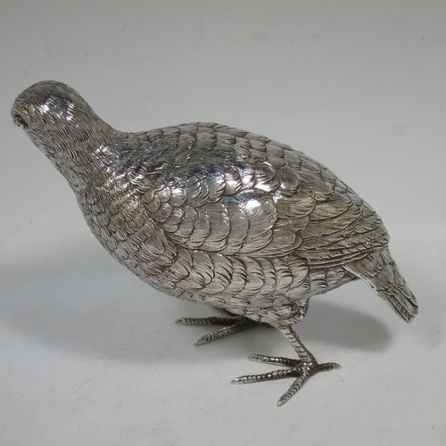 A very handsome and large pair of Sterling Silver partridge bird models, having realistically hand-chased feathers, faces, and feet. Bearing Import marks for London 1934. The dimensions of this fine hand-made sterling silver pair of partridge model birds are height 14 cms (5.5 inches), length 20 cms (8 inches), width 8 cms (3 inches), and they weigh a total of approx. 753g (24 troy ounces).    