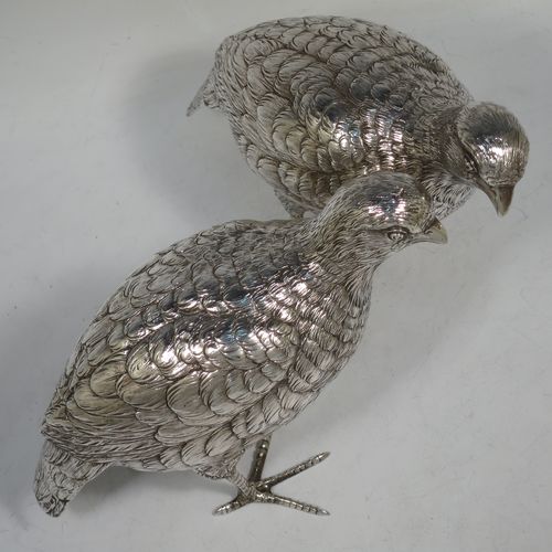 A very handsome and large pair of Sterling Silver partridge bird models, having realistically hand-chased feathers, faces, and feet. Bearing Import marks for London 1934. The dimensions of this fine hand-made sterling silver pair of partridge model birds are height 14 cms (5.5 inches), length 20 cms (8 inches), width 8 cms (3 inches), and they weigh a total of approx. 753g (24 troy ounces).    