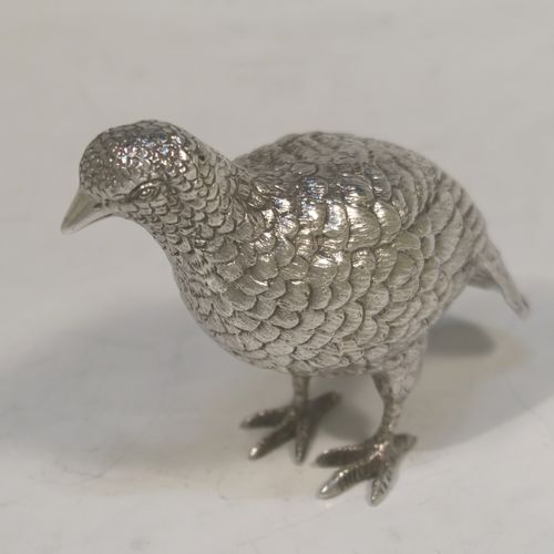 A very handsome Sterling Silver pair of solid cast partridges, showing a male and female bird in realistic traditional poses, finely detailed with hand-chased bodies and tail feathers. These beautiful silver partridges were made by Edward Barnard of London in 1979. The dimensions of these fine hand-made sterling silver partridges are length 10 cms (4 inches), width 4 cms (1.5 inches), height 8 cms (3.25 inches), and they weigh a total approx. 342g (11 troy ounces).   