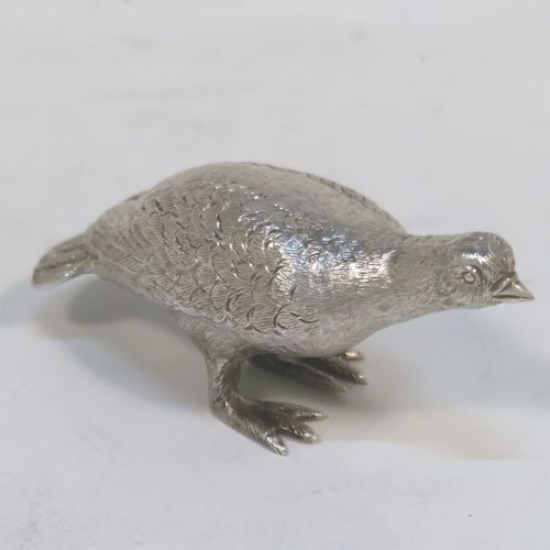 A handsome Sterling Silver solid cast model of a partridge bird, in a pose and having realistically hand-chased feathers. This elegant silver partridge model was made by Robert Comyns of London in 1971. The dimensions of this fine hand-made silver partridge model are height 3.5 cms (1.3 inches), length 7.5 cms (3 inches), width 3 cms (1.25 inches), and it weighs approx. 51g (1.6 troy ounces).   