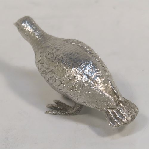 A handsome Sterling Silver solid cast model of a partridge bird, in a pose and having realistically hand-chased feathers. This elegant silver partridge model was made by Robert Comyns of London in 1971. The dimensions of this fine hand-made silver partridge model are height 3.5 cms (1.3 inches), length 7.5 cms (3 inches), width 3 cms (1.25 inches), and it weighs approx. 51g (1.6 troy ounces).   