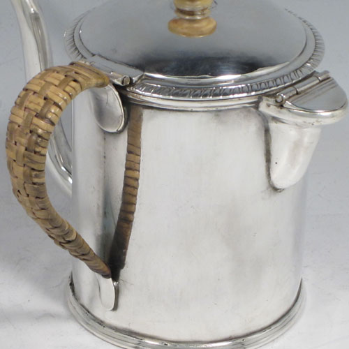 Antique Georgian sterling silver Argyll, having a plain round body with straight sides, a hinged lid with ivory finial, a scroll-shaped spout, a scroll handle with wicker-work insulation, a separate side spout with hinged lid for adding hot water, and sitting on a flat base. Made by Philip Norman of London in 1768. The dimensions of this fine hand-made silver Argyll are height 11.5 cms (4.5 inches), diameter 8 cms (3 inches), and it weighs approx. 390g (12.6 troy ounces).