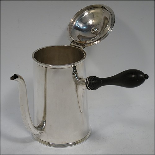 A very handsome Antique Victorian Sterling Silver gravy Argyll, having a plain round body with tapering sides and applied reeded borders, a domed hinged lid with wooden finial, a scroll pouring spout, a wooden handle that unscrews to reveal an opening for adding hot water to the water jacket, and all sitting on a flat base. Made D. and J. Welby of London in 1887. The dimensions of this fine hand-made antique silver Argyll are height 15 cms (6 inches), diameter at base 8.5 cms (3.3 inches), length 12 cms (4.75 inches), and it weighs approx. 350g (11.3 troy ounces).    