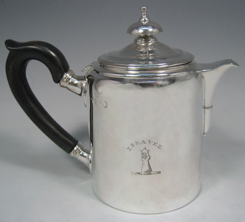 Antique Georgian sterling silver Argyll, having a plain round body with straight sides, a pull-off lid with silver finial, a short pouring spout, a wooden scroll handle, a side hole with hinged lid for adding hot water, and sitting on a flat base. Made by Richard Sibley I of London in 1812. The dimensions of this fine hand-made silver Argyll are height 13.5 cms (5.25 inches), diameter 8.5 cms (3.3 inches), and it weighs approx. 500g (16 troy ounces). Please note that this item is crested.