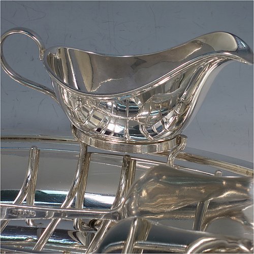 A Silver Plated asparagus serving set, having a plain oval body, with an applied rounded border, an original wire-work serving rack, a pair of plain serving tongs, and a sauce boat sat in a frame with loop handle, and all sitting on a flat base. Made by Deakin & Frances of Sheffield in ca. 1920. The dimensions of this fine hand-made silver-plated asparagus serving set are length 30.5 cms (12 inches), and width, 19.5 cms (7.75 inches).   