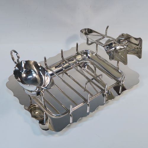 A very elegant Antique Edwardian Silver Plated asparagus serving set, having a plain rectangular body with a Chippendale border, a wire-work serving rack, a sauce boat sat in a frame with loop handle, a pair of asparagus server tongs, and all sitting on a flat base. This handsome silver-plated asparagus serving set was made made by Gladwins Ltd., of Sheffield in ca. 1910. The dimensions of this fine hand-made silver-plated asparagus serving set are length 28 cms (11 inches), and width, 21 cms (8.25 inches).  