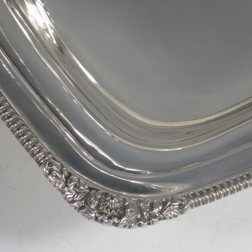 An Antique Edwardian Sterling Silver basket, having a rectangular body, with an applied gadroon and shell border, a hinged and swing handle with gadroon edges, all sitting on a plain pedestal foot. Made by the Barnard Brothers of London in 1903. The dimensions of this fine hand-made silver basket are height 21 cms (8.25 inches), length 27.5 cms (10.75 inches), width 20.5 cms (8 inches), and it weighs approx. 701g (22.6 troy ounces).   