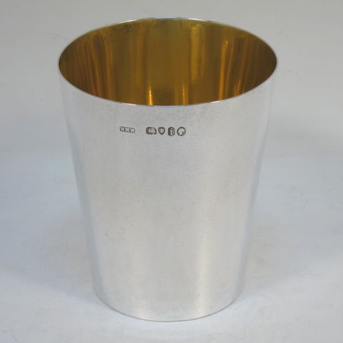 A very elegant Antique Victorian Sterling Silver beaker cup, having a very plain round body with tapering sides, sitting on a flat base, and with a gold-gilt interior. Made by Williams, Wrangham, and Withams of London in 1864. The dimensions of this fine hand-made antique silver beaker cup are height 9 cms (3.5 inches), diameter at top 7.5 cms (3 inches), and it weighs approx. 153g (4.9 troy ounces).  