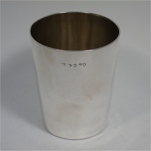 A very handsome Antique Georgian Sterling Silver beaker cup, having a very plain round body with tapering sides, sitting on a flat base, and with a gold-gilt interior. Made by Philip Batchelor (poss.) of London in 1789. The dimensions of this fine hand-made antique silver beaker cup are height 9 cms (3.5 inches), diameter at top 7.5 cms (3 inches), and it weighs approx. 116g (3.7 troy ounces).    