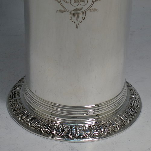 A Sterling Silver beaker in a 17th Century Charles I style, having a round straight-sided body with tapering sides, with hand-engraved floral work, all sitting on a hand-chased collet foot with an applied reeded band above. Made by Robert Frederick Fox of London in 1917. The dimensions of this fine hand-made silver beaker are height 13 cms (5 inches), diameter at top 8 cms (3 inches), and it weighs approx. 226g (7.3 troy ounces).   