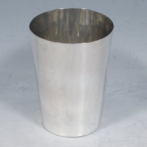 An Antique Georgian Sterling Silver beaker cup, having a very plain round body with tapering sides, and sitting on a flat base. Made by Samuel Godbehere, Edward Wigan & James Boult of London in 1811. The dimensions of this fine hand-made antique silver beaker cup are height 8 cms (3 inches), diameter at top 6 cms (2.25 inches), and it weighs approx. 90g (3 troy ounces).    