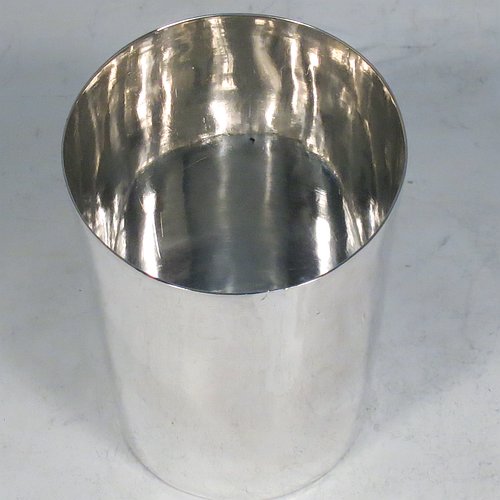 An Antique Georgian Sterling Silver beaker cup, having a very plain round body with tapering sides, and sitting on a flat base. Made by Samuel Godbehere, Edward Wigan & James Boult of London in 1811. The dimensions of this fine hand-made antique silver beaker cup are height 8 cms (3 inches), diameter at top 6 cms (2.25 inches), and it weighs approx. 90g (3 troy ounces).    