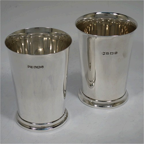 A very handsome Sterling Silver pair of beaker cups, having plain round bodies with tapering sides, and sitting on a collet foot with a reeded border. Made by S. Blanckensee and Sons of Birmingham in 1926/28. The dimensions of this fine pair of hand-made silver beakers are height 10 cms (4 inches), diameter at top 7.5 cms (3 inches), and they weigh a total of approx. 333g (10.7 troy ounces).   