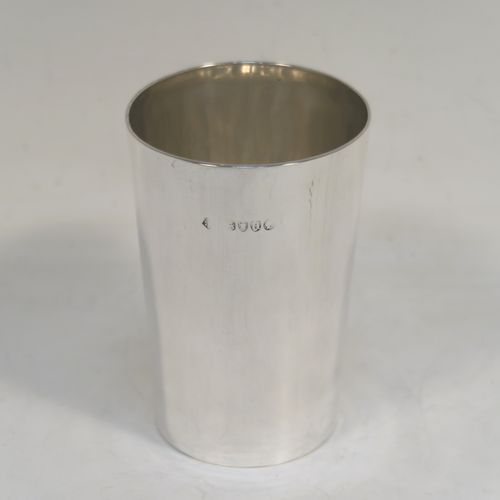 A handsome Antique Victorian Sterling Silver beaker cup, having a very plain round body with tapering sides, and sitting on a flat base. This elegant antique silver beaker was made by Martin Hall and Co. Ltd., of London in 1883. The dimensions of this fine hand-made antique silver beaker cup are height 9 cms (3.5 inches), diameter at top 6 cms (2.3 inches), and it weighs approx. 82g (2.6 troy ounces).  