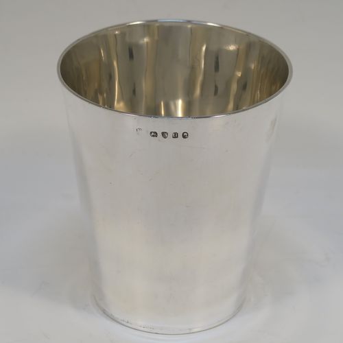 An elegant Antique Georgian Sterling Silver beaker, having a very plain round body with tapering sides,  and sitting on a flat base. This handsome silver beaker was made by Peter and Anne Bateman of London in 1795. The dimensions of this fine hand-made antique silver beaker are height 10 cms (4 inches), diameter at top 9 cms (3.5 inches), and it weighs approx. 168g (5.4 troy ounces).   