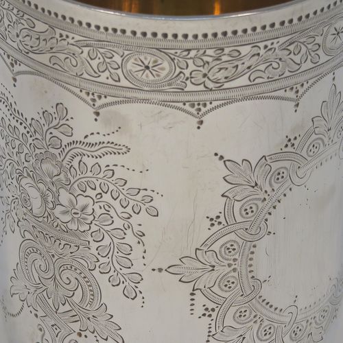 A beautiful Antique Victorian Sterling Silver beaker, having a round body with straight sides, with hand-engraved floral decoration, a gold-gilt interior, and all sitting on a flat base with tucked under belly. This very pretty silver beaker was made by the Barnard Brothers of London in 1877. The dimensions of this fine hand-made antique silver beaker are height 10 cms (4 inches), diameter at top 7 cms (2.75 inches), and it weighs approx. 119g (3.8 troy ounces).   