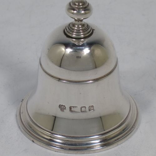 A very handsome Sterling Silver Georgian style table bell having a plain round body with applied reeded borders, a cast round baluster handle, and an original silver clapper. Made by C. J. Vander of London in 1972. The dimensions of this fine hand-made silver table bell are height 10 cms (4 inches), diameter at base 6 cms (2.3 inches), and it weighs approx. 158g (5 troy ounces).    