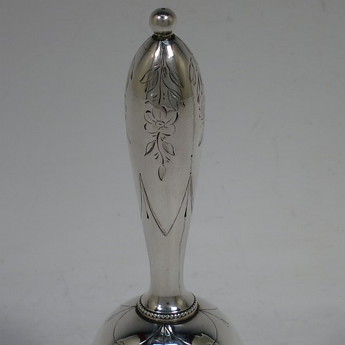 A very pretty Antique Victorian Sterling Silver table bell having a round baluster body with hand-engraved floral and scroll decoration, a tear-drop shaped handle with ball finial, with applied bead-edged borders, and an original silver clapper. Made by Hayne and Cater of London in 1863. The dimensions of this fine hand-made antique silver table bell are height 14 cms (5.5 inches), diameter at base 7 cms (2.75 inches), and it weighs approx. 132g (4.25 troy ounces). Please note that this item is crested. 