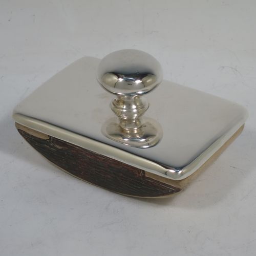 A handsome Antique Sterling Silver Rocker Blotter, having a very plain rectangular body with rounded corners, a leather covered rocker base, and a plain round handle that screws in to secure the rocker base and blotting paper to the upper body. Made by Stokes and Ireland of Chester in 1911. The dimensions of this fine hand-made antique silver rocker blotter are length 10 cms (4 inches), height 6 cms (2.3 inches), and width 6.5 cms (2.5 inches).    