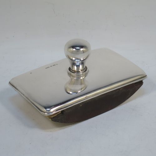 A very handsome Antique Edwardian Sterling Silver rocker blotter, having a very plain rectangular body with rounded corners, a leather covered rocker base, and a plain round handle that screws in to secure the rocker base and blotting paper to the upper body. Made by Henry Matthews of Birmingham in 1905. The dimensions of this fine hand-made antique silver rocker blotter are length 12 cms (4.75 inches), height 6 cms (2.3 inches), and width 7.5 cms (3 inches)  