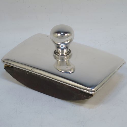 A very handsome Antique Edwardian Sterling Silver rocker blotter, having a very plain rectangular body with rounded corners, a leather covered rocker base, and a plain round handle that screws in to secure the rocker base and blotting paper to the upper body. Made by Henry Matthews of Birmingham in 1905. The dimensions of this fine hand-made antique silver rocker blotter are length 12 cms (4.75 inches), height 6 cms (2.3 inches), and width 7.5 cms (3 inches)  