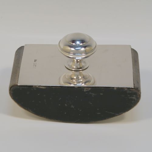 A handsome Antique Sterling Silver Rocker Blotter, having a very plain rectangular body, a solid wooden  rocker base, and a plain round domed handle that screws in to secure the rocker base and blotting paper to the upper body. This elegant silver rocker blotter was made by George Unite of Birmingham in 1915. The dimensions of this fine hand-made antique silver rocker blotter are length 11 cms (4.3 inches), height 7 cms (2.75 inches), and width 7 cms (2.75 inches).  