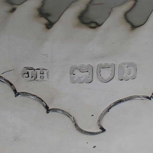 An Antique Victorian Sterling Silver large table bowl, having a round body with an applied reeded border and hand-chased half swirl-fluted decoration, all sitting on a pedestal foot which is also fluted. Made by Sibray, Hall & Co., of London in 1897. The dimensions of this fine hand-made antique silver bowl are diameter 25.5 cms (10 inches), height 19 cms (7.5 inches), and it weighs approx. 1,041g (33.6 troy ounces).   