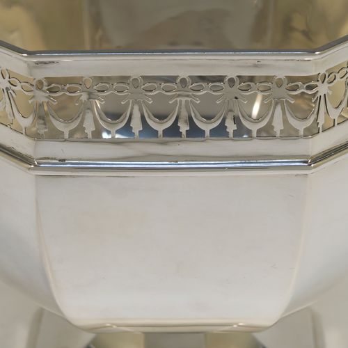 A very handsome Antique Sterling Silver table bowl, having a plain octagonal panelled body, with an applied neoclassical style and hand-pierced top border, and all sitting on a pedestal foot. This beautiful antique silver bowl was made by Charles S. Green and Co., of Birmingham in 1914. The dimensions of this fine hand-made antique silver bowl are width 23 cms (9 inches), height 18.5 cms (7.25 inches), and it weighs approx. 828g (27 troy ounces).   