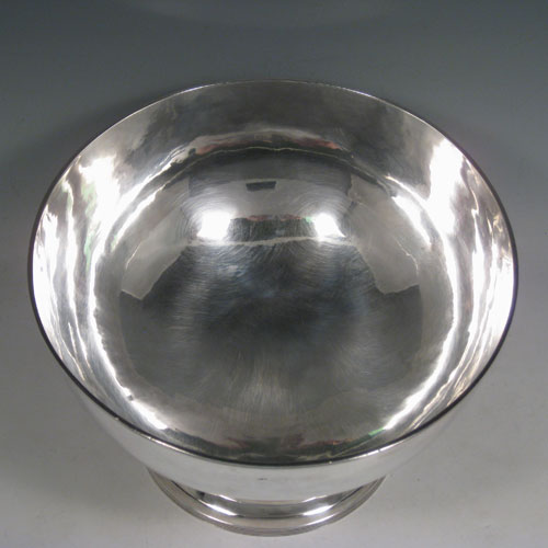 Antique Georgian sterling silver very rare large table bowl, having a plain round body, applied reeded borders, and sitting on a pedestal foot. Made by Thomas Howell of London in 1797, with an extra makers mark on the body. Height 18 cms (7 inches), diameter 25.5 cms (10 cms). Weight approx. 1,092g (35.2 troy ounces).