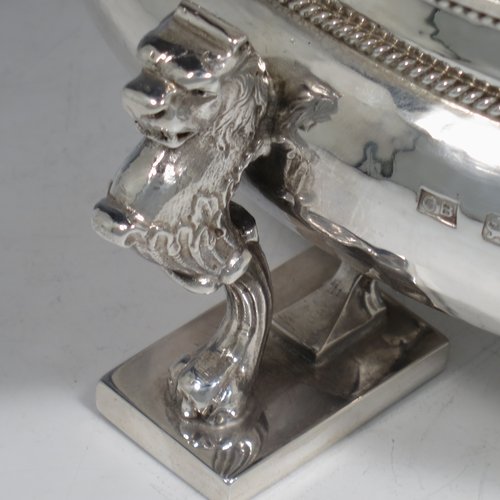 A Sterling Silver Arts & Crafts rose bowl, having a round hand-hammered baluster body with applied rope-twist borders, and sitting on three cast scroll leopards feet. Made by Charles Boyton of London in 1937. The dimensions of this fine hand-made silver bowl are height 9 cms (3.5 inches), diameter 23 cms (9 inches), and it weighs approx. 1,006g (32 troy ounces).    