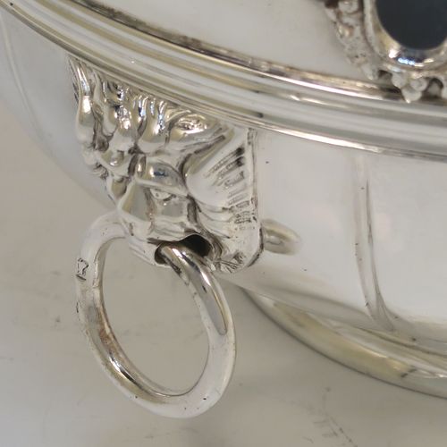 A very elegant Antique Victorian Sterling Silver bowl in a Monteith style, having a round body with hand-chased bands of fluting, an applied cast floral top border, with two cast lions-mask and ring side-handles, and all sitting on a round collet foot. This beautiful antique silver Monteith style bowl was made by Vander and Hedges of London in 1899. The dimensions of this fine hand-made silver bowl are height 8 cms (3.25 inches), diameter 16 cms (6.25 inches), and it weighs arox. 351g (11.3 troy ounces).   