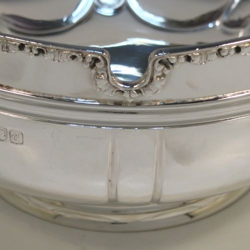 A very elegant Antique Victorian Sterling Silver bowl in a Monteith style, having a round body with hand-chased bands of fluting, an applied cast floral top border, with two cast lions-mask and ring side-handles, and all sitting on a round collet foot. This beautiful antique silver Monteith style bowl was made by Vander and Hedges of London in 1899. The dimensions of this fine hand-made silver bowl are height 8 cms (3.25 inches), diameter 16 cms (6.25 inches), and it weighs arox. 351g (11.3 troy ounces).   